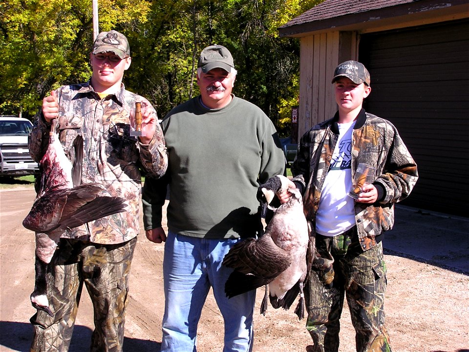 Youth with banded geese photo