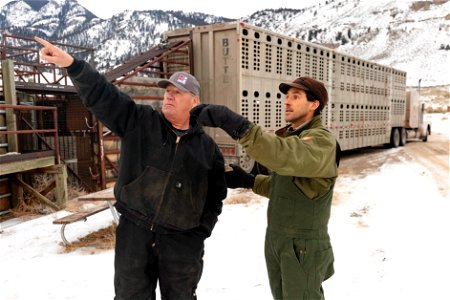 Robbie Magnan, director of the Fort Peck Fish and Wildlife Department, and Chris Geremia, senior bison biologist, discuss bison loading operations