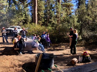 A group of kids learn about forest science at an Every Kid Outdoors Field Day