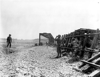 SC 337261 - Engineers are putting a railroad bridge in order for the handling of tanks.