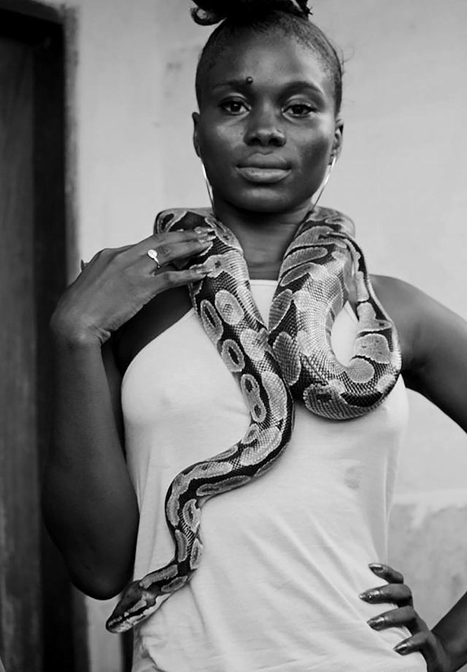 Woman black and white python