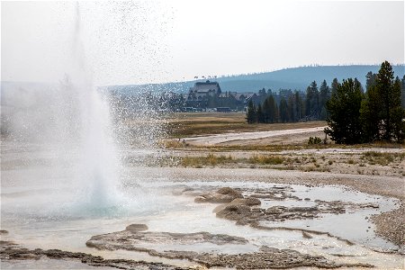 Sawmill Geyser eruption and Old Faithful Inn photo