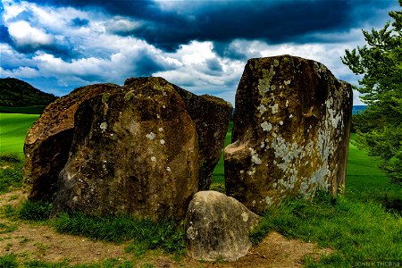 The Coldrum Long Barrow, also known as the Coldrum Stones and the Adscombe Stones, is a chambered long barrow located near the village of Trottiscliffe in the south-eastern English county of Kent.