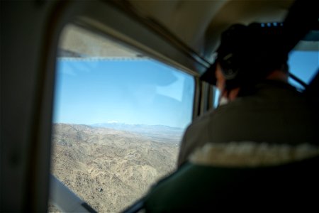Park ranger inside NPS patrol plane photo