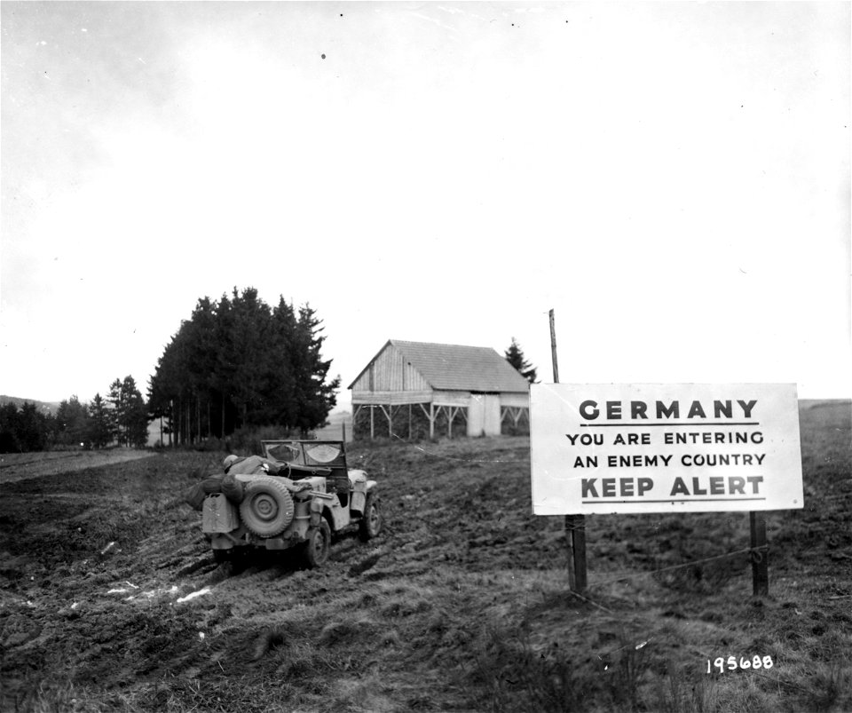 SC 195688 - This sign on a roadway leading into Germany serves as a warning to American infantrymen. 20 October, 1944. photo