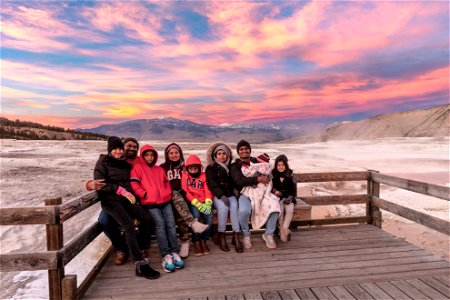 Family photo under a sunset at Mammoth Hot Springs
