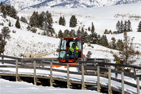 Snow removal equipment clears snow from the boardwalk in Mammoth Hot Springs (2)