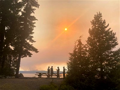 Visitors and Public Information Officers talk during the Cedar Creek Fire on the Willamette National Forest. August 7, 2022