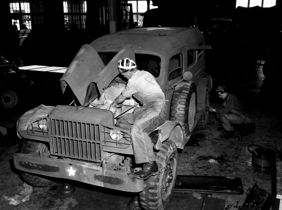 SC 184885 - A German war prisoner at Camp Wallace, Texas, is shown at his assigned job working on a truck at Ordnance Command Shop #5. 1943.