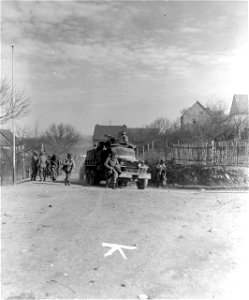 SC 270680 - 5th Infantry Division units of 3rd U.S. Army move up through town of Chorweiler, Germany. 16 March, 1945. photo