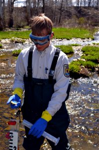Biological Science Technician Nick Steimel measures the amount of lampricide entering the stream to ensure its effective at targeting sea lampreys while minimizing impacts on non-target species. photo