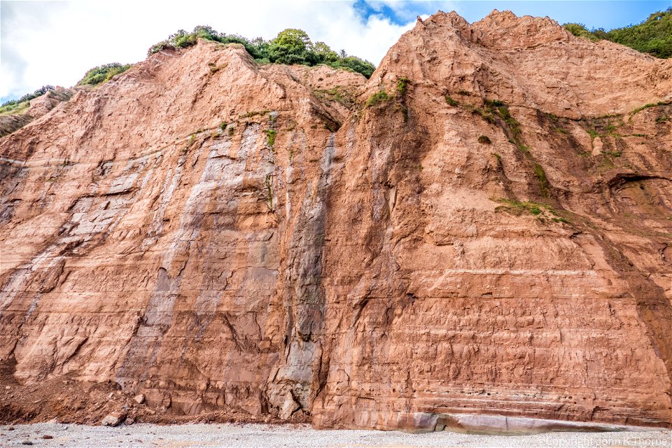 500 Feet High Otter Sandstone, Mercia Mudstone Sidmouth Dorset. Small Chine waterfall.