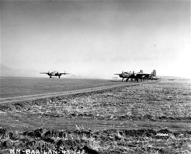 SC 170044 - B-25 bombers taking off for a raid. Berteux, North Africa. 12 February, 1943.