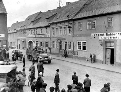 SC 336926 - Halftrack of 9th Armored Division, 1st U.S. Army, drives through Wiehe, Germany, on route to the Elbe River. 12 April, 1945.