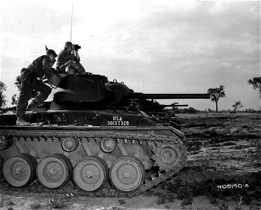 SC 405190-S - Men of the 102nd Armored Cavalry Regiment, New Jersey National Guard, share a tense moment atop their M-24 tank as they await results of .50 caliber machine gun firing.