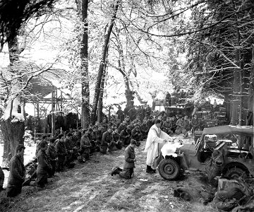 SC 198882 - Chaplain (Capt.) Joseph P. Kenny, 508th Parachute Infantry Regiment, holds mass for men of the 3rd Battalion before they depart for the field in Belgium. 6 January, 1945. photo
