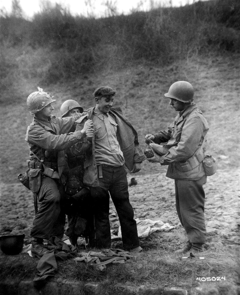 SC 405204 - A Russian refugee who yesterday saved a wounded tankman of the 10th Armored Division, by dragging him from a burning tank and remaining with him until medics arrived.