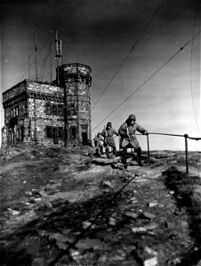 SC 335411 - Cpl. Victor Dutko, of Youngstown, Ohio; Pfc. Randolph B. Brand, of Terra Ceira, Fla., and Cpl. Felix E. Walsh of Petersburg, Tenn., walking guard in front of Cabot Tower, where Marconi first received his wireless message... photo