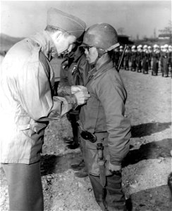 SC 3640664 - Sec. of Army Frank Page, Jr., pins the Silver Star medal on Lt. Cho Toug Suk, 5th ROK Div., at ceremonies held at the Honchon airstrip, Korea.