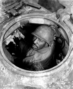 SC 196106-S - Cpl. Carlton Chapman, Pembroke, Va., is a machine gunner in an M4 tank, attached to a Motor Transport unit near Nancy, France. 5 November, 1944.