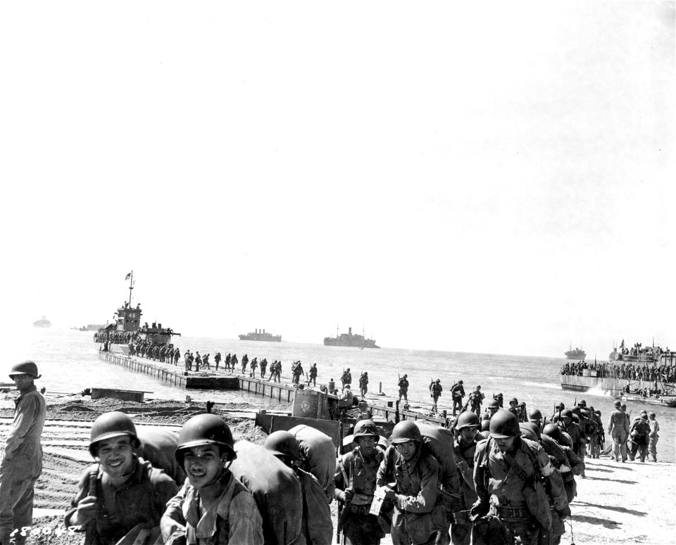 SC 180048 - A convoy unloading men and supplies north of Agropoli, Italy. 21 September, 1943.