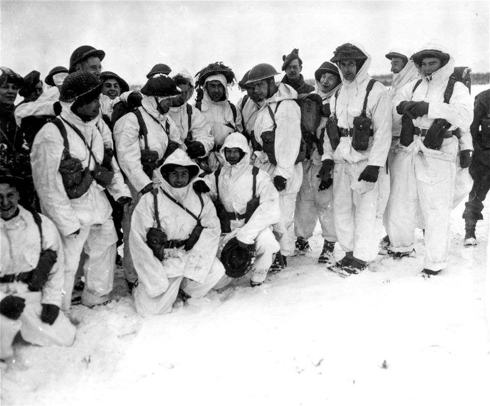 SC 199070 - Men of a Scottish infantry unit, 153rd Brigade, 5th Black Watch, 51st Highland Div., pose in their new camouflage snow suits near near Marene, Belgium. 9 January, 1945.