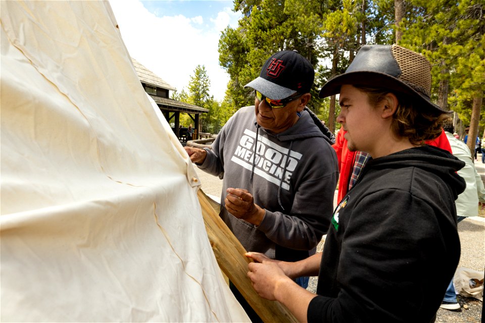 Yellowstone Tribal Heritage Center opening day 2023:Artis Mike Redman shows how to tie the canvas together