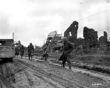 SC 270805 - Men of the 121st Regt., 8th Inf. Div., U.S. First Army, after 15 days at the front, move back along the road from Hurtgen, Germany. 5 December, 1944. photo