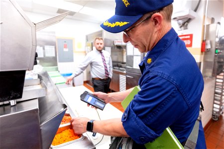Commander George Larsen, Public Health Consultant, inspecting food services (4)