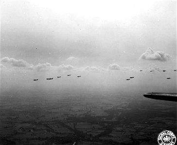 SC 195705 - Formations of C-47 troop carrier command planes wing over Holland during Allied landings. 17 September, 1944.