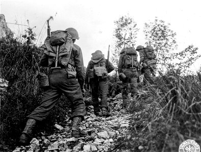 SC 270610 - Silhouette of the 30th Inf. Regt., 3rd Div., 1st Bn., as they move toward very difficult terrain, mostly mountains. Caserta, Italy. 2 November, 1943. photo