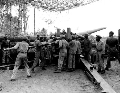 SC 364569 - Loading a 155mm M1 rifle of Btry B, 49th Coast Artillery, Section 2, negro troops operating. 16 April, 1944.