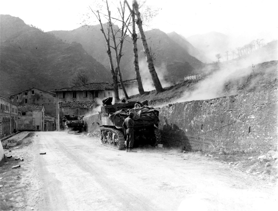 SC 329840 - As the 442nd Inf. Regt. (Nisei) pushes on Mt. Belvedere, tanks of the 758th Light Tank Bn. (Negro) fire in support with 75mm howitzers from Seravezza. 4 April, 1945.