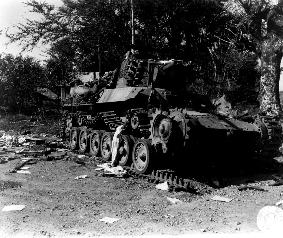 SC 337247 - Jap medium tanks which head the convoy of 30 trucks, 8 tanks and 8 field pieces is shown knocked out by two bazooka shells.