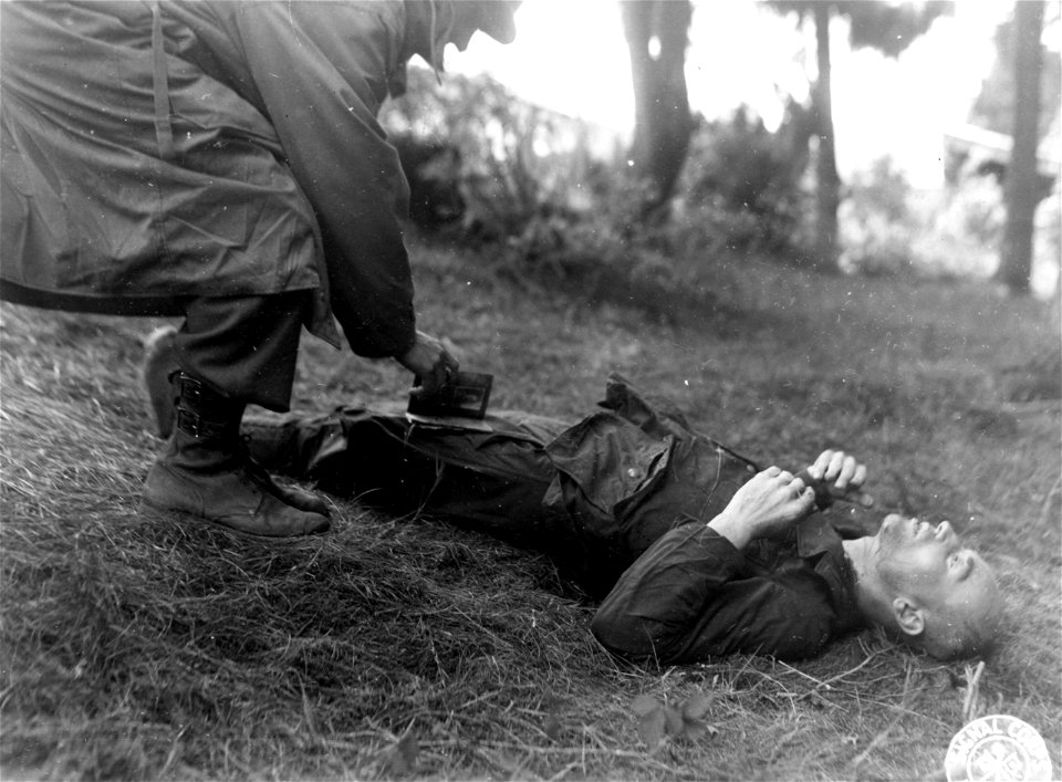 SC 195719 - 143rd Inf. soldiers caught this German sneaking into house in town they occupied. 24 September, 1944.