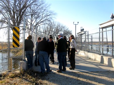 USFWS and state wildlife management staff discuss partnerships at refuge weir photo