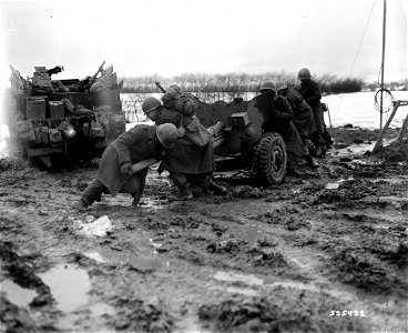 SC 335432 - An anti-tank gun is rapidly put into position in a forward area on the German-Belgium border, to repel a strong German counter attack in the First Army sector. photo