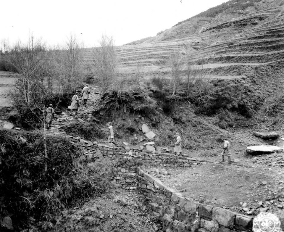 SC 374809 - Patrol winds its way up mountain over rocky terrain. North of Pracahia, Italy. 7 December, 1944.