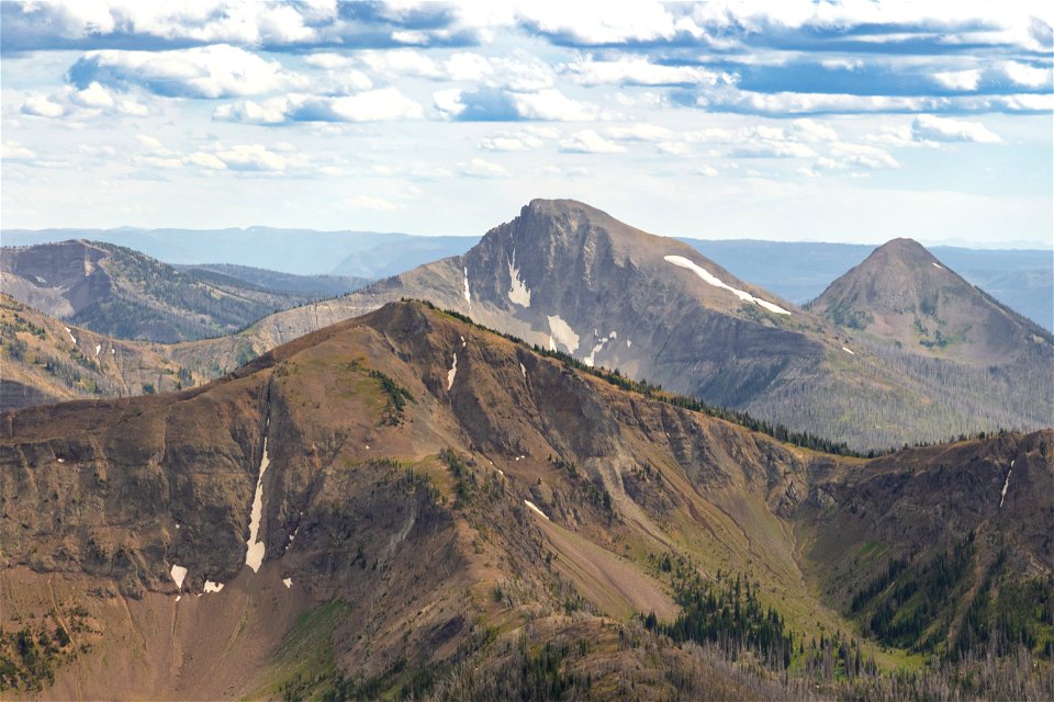 First Peoples Mountain (center) rises between Top Notch Peak (foreground) and Mt. Stevenson (back right) seen from Avalanche Peak