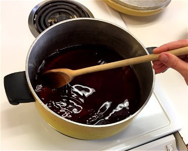 Stirring grape juice for jelly