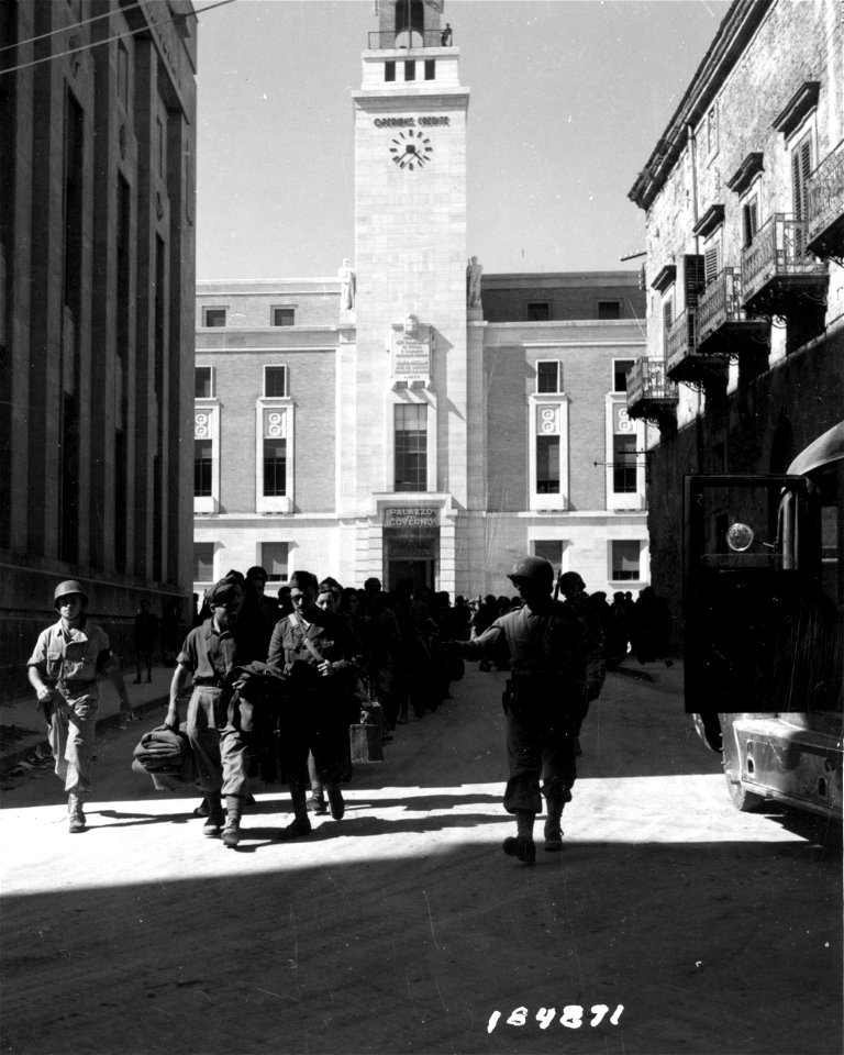 SC 184871 - American M.P.s march Italian war prisoners from Palazo Del Governo to prison camp. Enna, Sicily. 21 July, 1943.