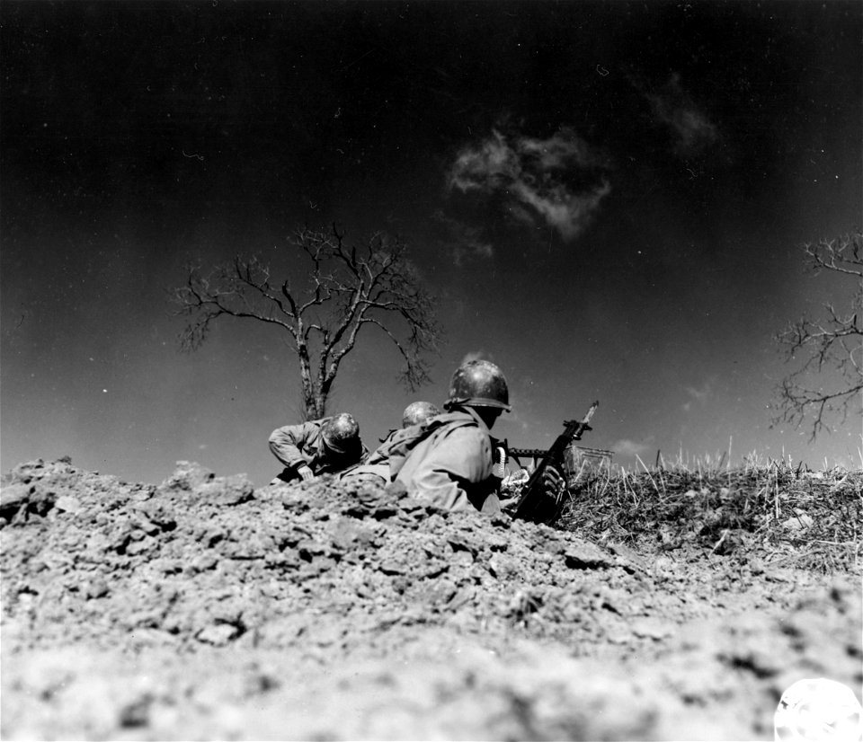 SC 270849 - Riflemen of "K" Co., 87th Mtn. Inf., 10th Mtn. Div., firing at German positions 200 yards away during the attack up the Porretta-Moderna Highway. 3 March, 1945.
