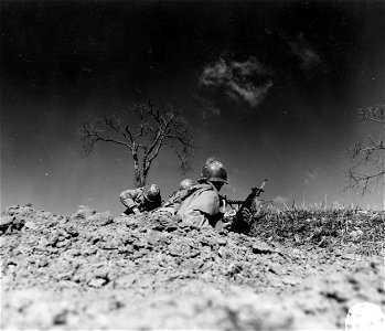 SC 270849 - Riflemen of "K" Co., 87th Mtn. Inf., 10th Mtn. Div., firing at German positions 200 yards away during the attack up the Porretta-Moderna Highway. 3 March, 1945. photo