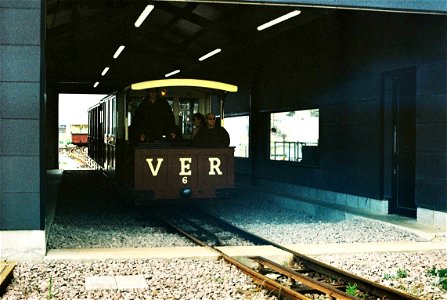 Volks Electric Railway train passing through car sheds photo