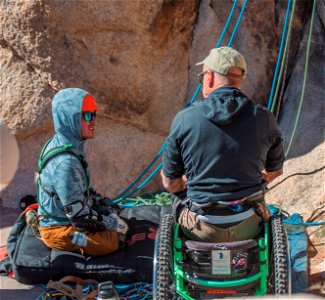 Disabled Climber and Instructor Discuss Climbing Route