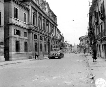 SC 270876 - Tanks of the 13th Armd. Bn., 1st Armd. Div., attached to the 10th Mtn. Div., passes down street in Verona, Italy. 26 April, 1945. photo