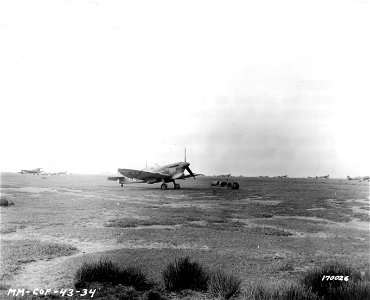 SC 170026 - Spitfires at Tebessa, North Africa after being evacuated from Thelepte, North Africa. 18 February, 1943. photo