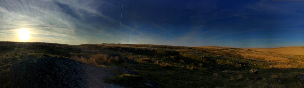 Sunset , Aeroplane Vapour Trails, Evil Combe, Dartmoor National Park, Devon, UK. 16th April 2022 (Apple Ipod Panoramic Photo)
