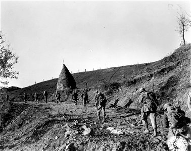 SC 270845 - A battalion of the 87th Mtn. Inf., 10th Mtn. Div., previously in regimental reserve, moves up to take over positions won by the 1st Bn., 87th Mtn. Inf., during the attack of the night of 19-20 Feb. photo