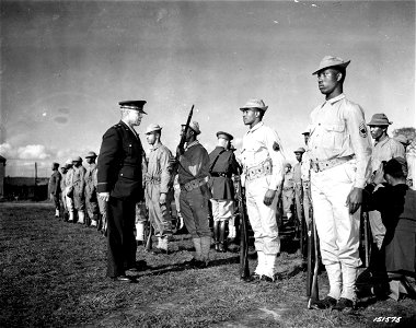 SC 151575 - Brig. Gen. Benjamin O. Davis is greatly satisfied with the skill of the individual soldier during a close inspection of colored troops in England. photo